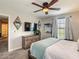 Bedroom with wooden dresser, wall-mounted TV, and a window with blinds at 1491 Rolling Fairway Dr, Davenport, FL 33896