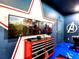 Awesome game room with dual tv's, avengers theme, and finished with a red toolbox at 1491 Rolling Fairway Dr, Davenport, FL 33896