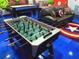 Impressive game room features custom murals with superhero theme and a foosball table at 1491 Rolling Fairway Dr, Davenport, FL 33896