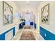 Bright hallway with tile flooring, stylish mirrors, and decorative accents creates an elegant and welcoming entryway at 1491 Rolling Fairway Dr, Davenport, FL 33896