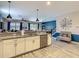 Spacious kitchen with granite countertops, stainless steel appliances, and an open layout to the living area at 1491 Rolling Fairway Dr, Davenport, FL 33896