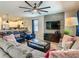 Inviting living room with a comfortable sectional sofa, contemporary decor, and open layout with easy access to the kitchen at 1491 Rolling Fairway Dr, Davenport, FL 33896
