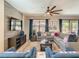 Inviting living room with a comfortable sectional sofa, modern entertainment setup, and bright, airy atmosphere at 1491 Rolling Fairway Dr, Davenport, FL 33896
