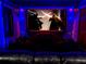 Immersive media room with a large screen and themed decor, creating a fantastic entertainment space for movie lovers at 1491 Rolling Fairway Dr, Davenport, FL 33896