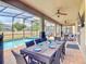 The outdoor dining area is perfect for entertaining, with seating for eight and views of the pool at 1491 Rolling Fairway Dr, Davenport, FL 33896