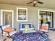 Inviting outdoor space with comfortable seating and vibrant rug at 1491 Rolling Fairway Dr, Davenport, FL 33896
