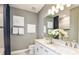 Elegant bathroom with double vanity, granite countertop, and modern fixtures providing a luxurious feel at 15148 Willow Ridge Dr, Montverde, FL 34756