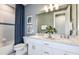 Stylish bathroom with double vanity, granite countertops, and modern fixtures and finishes at 15148 Willow Ridge Dr, Montverde, FL 34756