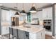 Bright kitchen featuring a large island, stainless steel appliances and ample cabinet space at 15148 Willow Ridge Dr, Montverde, FL 34756