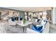 Open-concept living space with stylish furniture, seamless flow to the kitchen, and modern decor at 15148 Willow Ridge Dr, Montverde, FL 34756