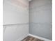 Bright walk-in closet with wire shelves, offering ample space for clothes and personal items at 15148 Willow Ridge Dr, Montverde, FL 34756