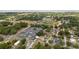 Wide aerial view showcasing the neighborhood, baseball fields, and a community pool near well-maintained homes at 18 Cooledge St, Winter Garden, FL 34787