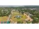 A high angle view shows a meticulously maintained baseball field with a nice neighborhood and distant lake view at 18 Cooledge St, Winter Garden, FL 34787