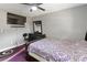 This bedroom features a desk, a dresser with mirror, and a ceiling fan at 18 Cooledge St, Winter Garden, FL 34787