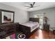 This bedroom has wood floors, and a window with natural light at 18 Cooledge St, Winter Garden, FL 34787