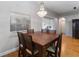 Dining room with a large wooden table, chandelier, and sliding glass doors at 18 Cooledge St, Winter Garden, FL 34787