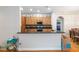 Contemporary kitchen with granite counters, wood cabinets, and stainless steel appliances at 18 Cooledge St, Winter Garden, FL 34787
