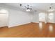 Open-concept living room features wood floors, bright walls, archways and recessed lighting at 18 Cooledge St, Winter Garden, FL 34787