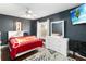 This main bedroom features a ceiling fan and a large window for natural light at 18 Cooledge St, Winter Garden, FL 34787