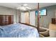 This main bedroom offers a ceiling fan and a large TV at 18 Cooledge St, Winter Garden, FL 34787