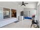 This large sunroom features tile flooring, a refrigerator, and access to the backyard at 18 Cooledge St, Winter Garden, FL 34787