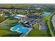 Community aerial view showcasing a large pool, community center, and green space at 201 Churchill Ct, Kissimmee, FL 34758
