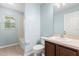A traditional bathroom with a shower-tub combo, window, and vanity at 201 Churchill Ct, Kissimmee, FL 34758