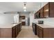 Spacious kitchen boasts wood cabinets and stainless appliances at 201 Churchill Ct, Kissimmee, FL 34758
