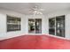 Covered patio features ceiling fan, sliding glass doors, and ample space at 201 Churchill Ct, Kissimmee, FL 34758