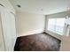 Bedroom with closet, plush carpet, window with blinds, and natural light at 2025 Claudia Ln # 2025, Kissimmee, FL 34741