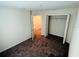 A bedroom with neutral walls, cozy carpeting, and closet for storage at 2025 Claudia Ln # 2025, Kissimmee, FL 34741