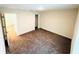 A bright bedroom features neutral walls, cozy carpeting, and a closet for storage at 2025 Claudia Ln # 2025, Kissimmee, FL 34741
