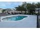 Community swimming pool surrounded by well-maintained grounds and clear blue water at 2025 Claudia Ln # 2025, Kissimmee, FL 34741