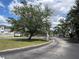 Street view showing community entrance sign and manicured landscaping of Dimora Park at 2025 Claudia Ln # 2025, Kissimmee, FL 34741
