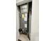 A furnace and water tank are contained within a small utility closet at 2025 Claudia Ln # 2025, Kissimmee, FL 34741
