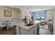 Open living space with a modern kitchen, dining area, and living room, creating a functional layout at 2092 Monteverde Ave, Davenport, FL 33837
