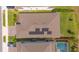 Aerial view of a single-Gathering home with solar panels on the roof at 2490 Southlawn Ln, Clermont, FL 34714