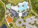 Aerial view of a community pool, splash pad, playground and parking at 2490 Southlawn Ln, Clermont, FL 34714