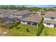 Backyard view of a single-Gathering home with a screened pool enclosure at 2490 Southlawn Ln, Clermont, FL 34714