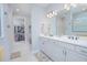 Elegant bathroom features a double vanity with modern fixtures and a walk-in closet at 2490 Southlawn Ln, Clermont, FL 34714