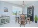 Cozy breakfast nook featuring a barrel table, bar stools, and natural lighting at 2490 Southlawn Ln, Clermont, FL 34714