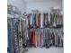 Spacious walk-in closet with ample shelving and hanging space for organized storage at 2490 Southlawn Ln, Clermont, FL 34714