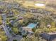Aerial view of the community featuring a pool, landscaping, and surrounding apartments at 2586 Robert Trent Jones Dr # 1116, Orlando, FL 32835