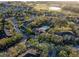 Aerial view of the community featuring a pool, landscaping and surrounding apartments at 2586 Robert Trent Jones Dr # 1116, Orlando, FL 32835