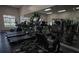 Well-equipped gym with modern cardio machines and mirrored walls at 2586 Robert Trent Jones Dr # 1116, Orlando, FL 32835