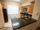 Galley kitchen with lots of cabinet space and granite countertop bar at 2586 Robert Trent Jones Dr # 1116, Orlando, FL 32835