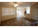 Open floor plan with hardwood floors, ceiling fan, and neutral colors at 2586 Robert Trent Jones Dr # 1116, Orlando, FL 32835