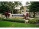 Community entrance sign surrounded by lush landscaping and manicured gardens at 2586 Robert Trent Jones Dr # 1116, Orlando, FL 32835