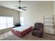 Spacious bedroom with ceiling fan and carpet flooring at 2611 Shantiniketan Blvd # G-11, Tavares, FL 32778