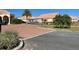 Wide view of the community entrance with a gate, providing security and a welcoming atmosphere for residents and guests at 2611 Shantiniketan Blvd # G-11, Tavares, FL 32778